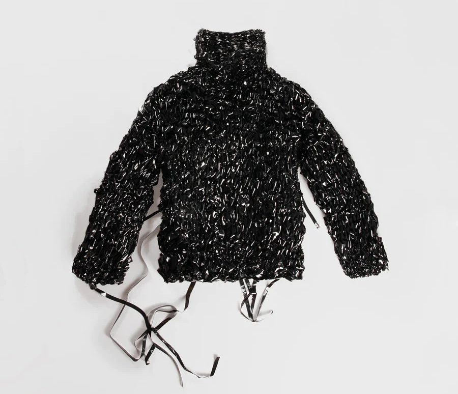 Alongside the dress made of video tape, a sweater in the same material is also sold.